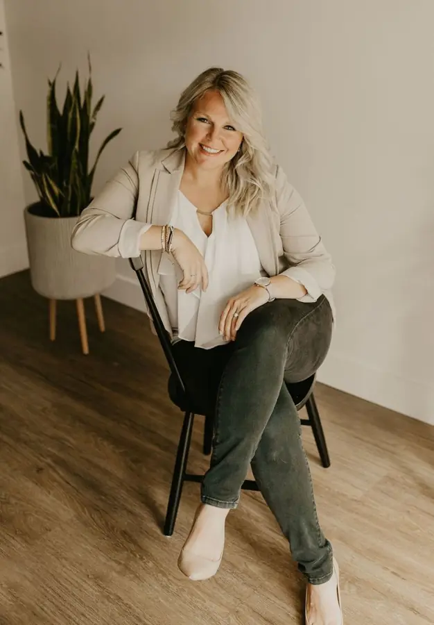 Aliza Litke seated in a studio portrait