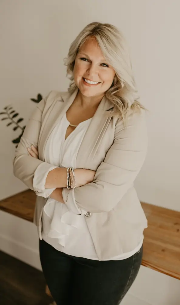 Aliza Litke, smiling with arms crossed