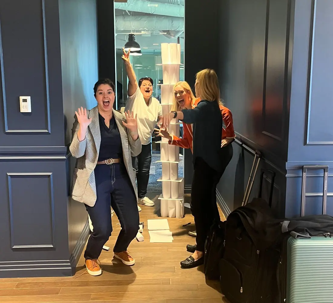 Workshop participants celebrating during a Strengths Escape Room